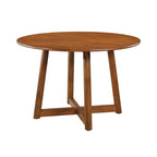 Table à manger ronde avec piètement ajouré, finition noyer